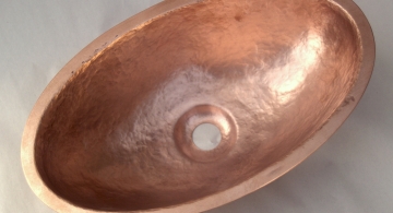 Very small hammered copper sink for a client's private jet.