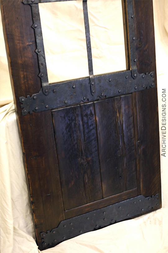 Bottom half of door, with rustic iron and wood elements