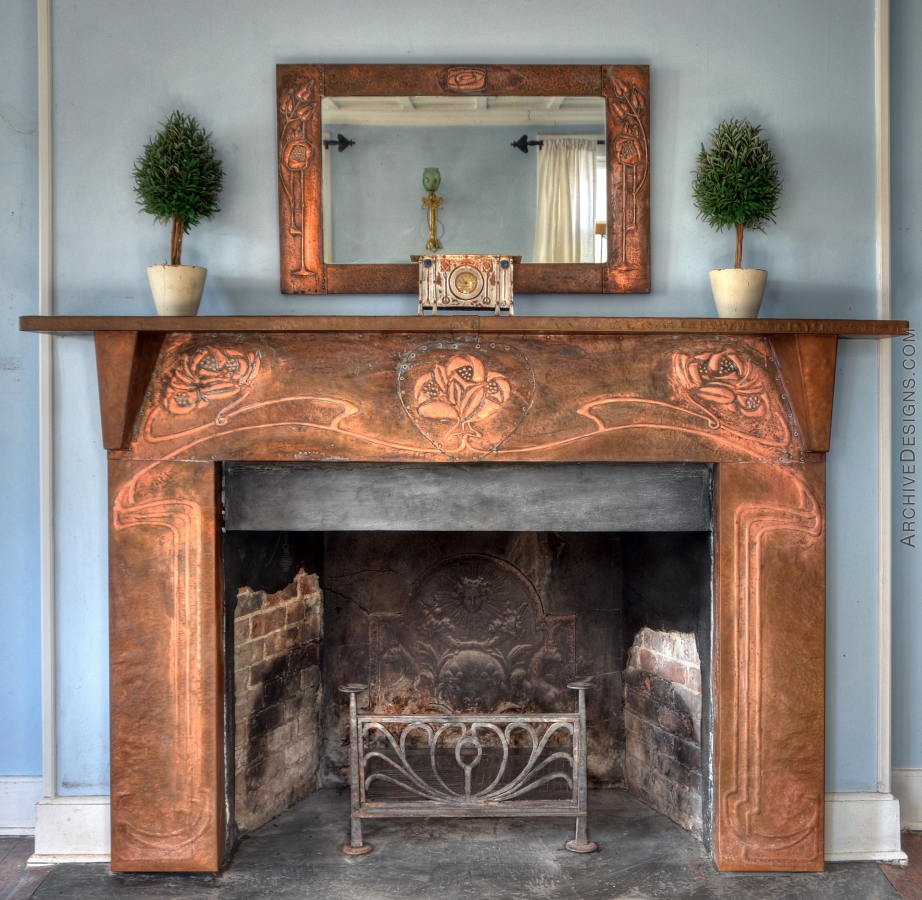 A near-reproduction of a copper fireplace surround originally designed by Walton. The Voysey wrought iron fire basket is also a near reproduction, as the structure has been modified for wood-burning in Sag Harbor instead of coal-burning in Glasgow or London. The clock and mirror are originals; probably Walton's.