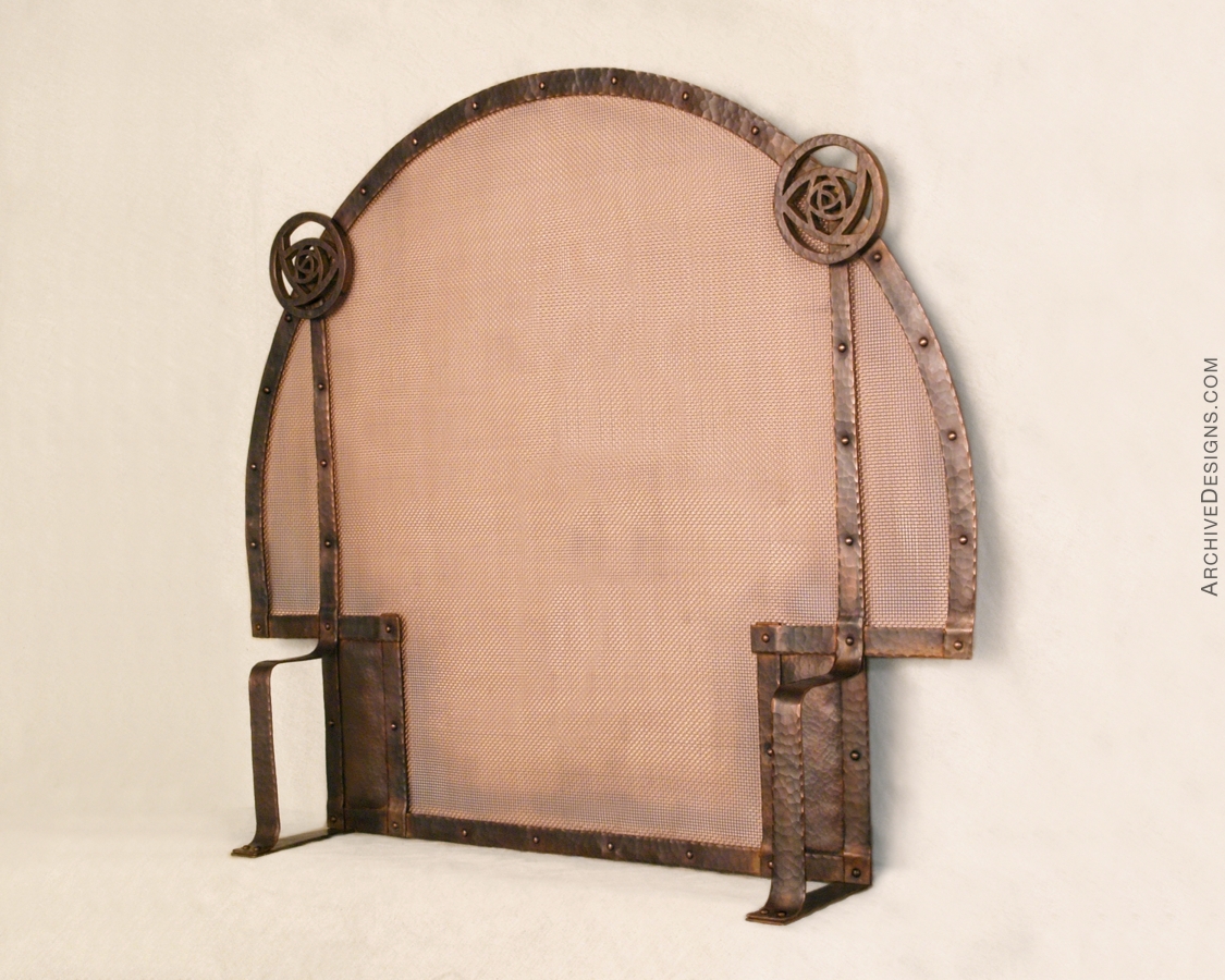 Hammered copper screen for arched fireplace, by Archive Designs.